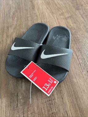 Nike Black Slides with White Swoosh Logo